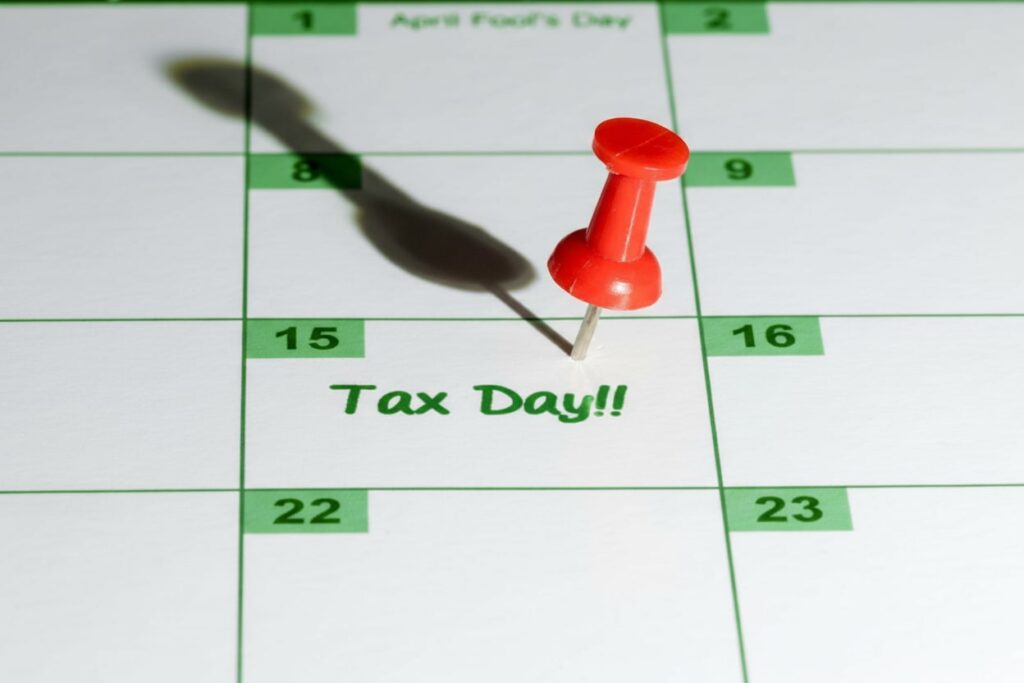 Red pin marking Tax Day on calendar